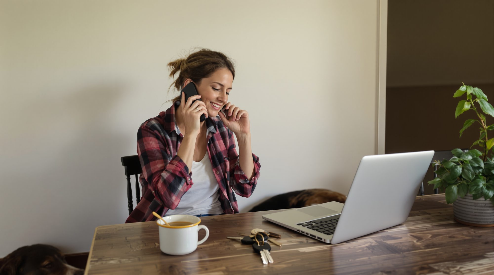 A Peninsula business owner on the phone at her kitchen table, working out who to hire